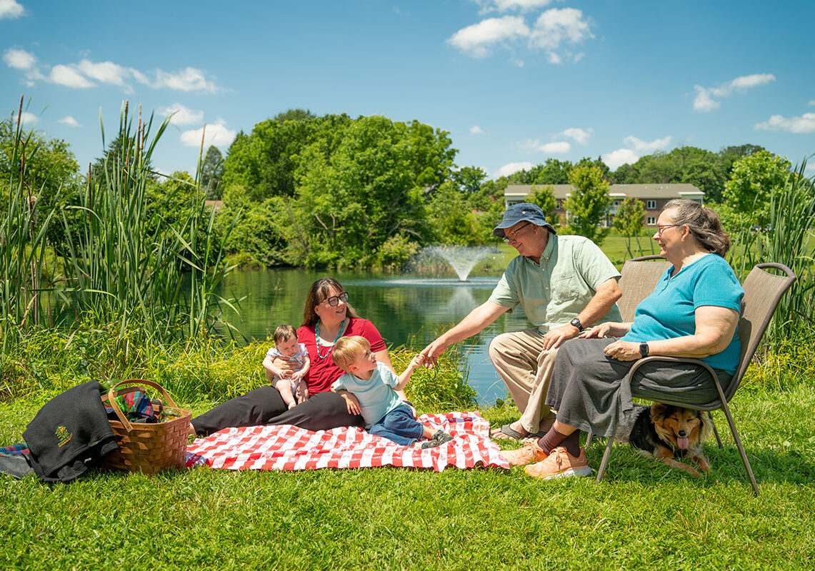 resident and family having picnic at Friends House